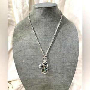 Labradorite Wire Wrapped W/ A Small bead of Turquoise Caged in a Hammered Wire.